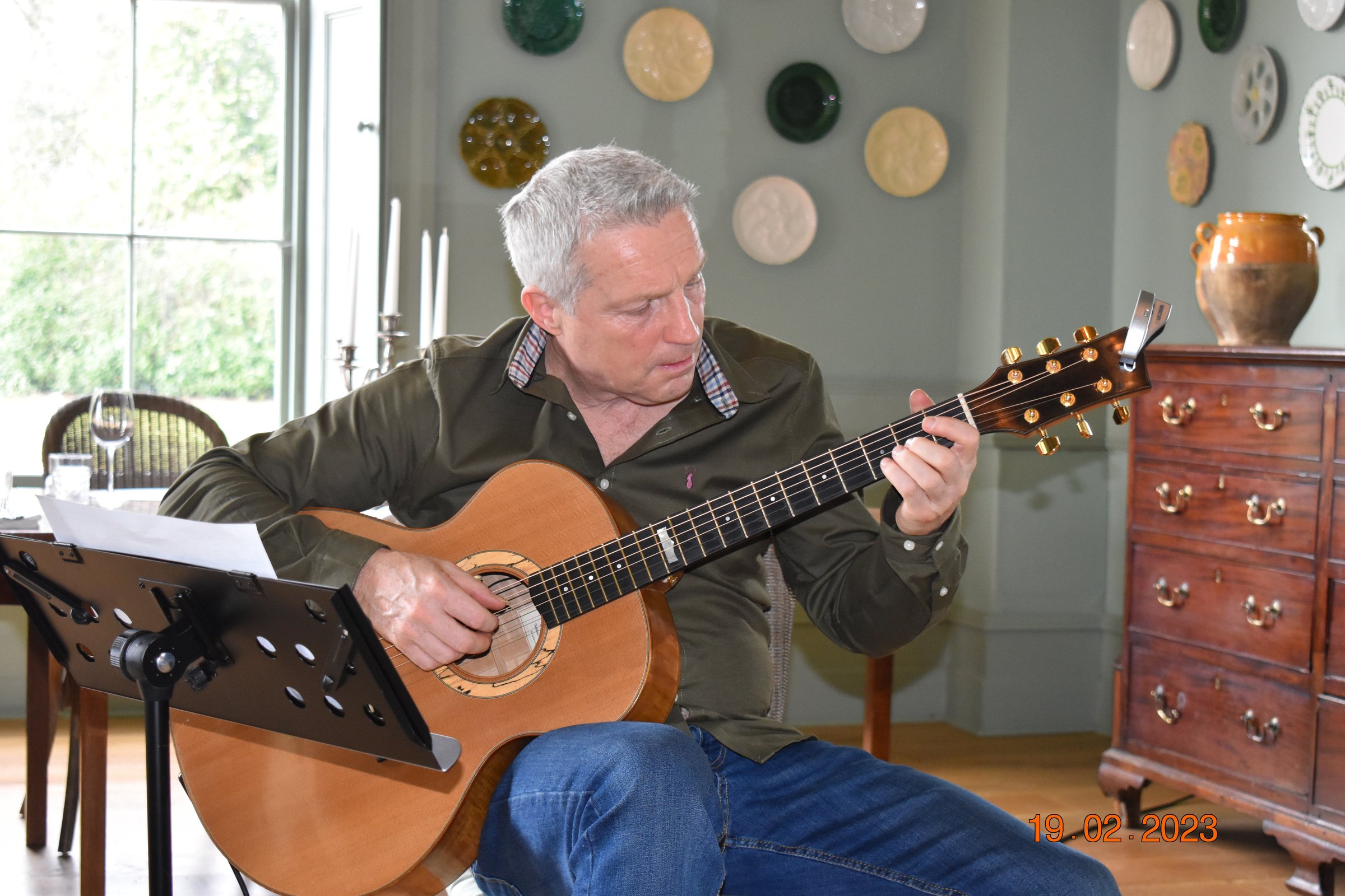 Mike Edwards playing guitar at The Retreat